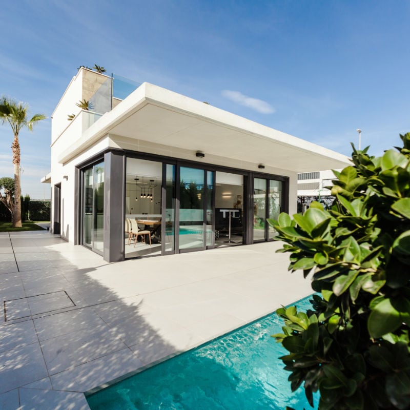 White and grey concrete building near swimming pool